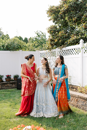 Bride with sisters posing for camera