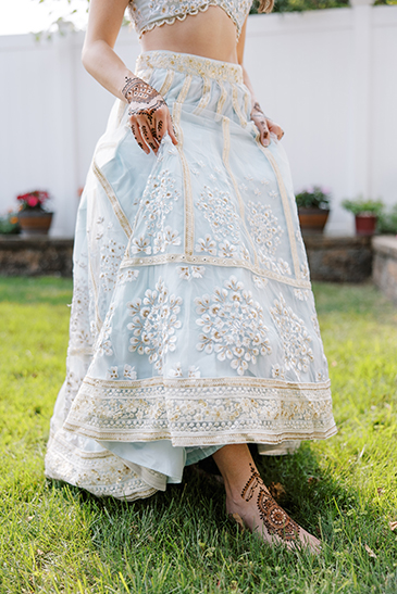 Brides skirt and foot showing her henna design