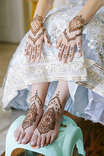 Close up of brides henna on hands and feet