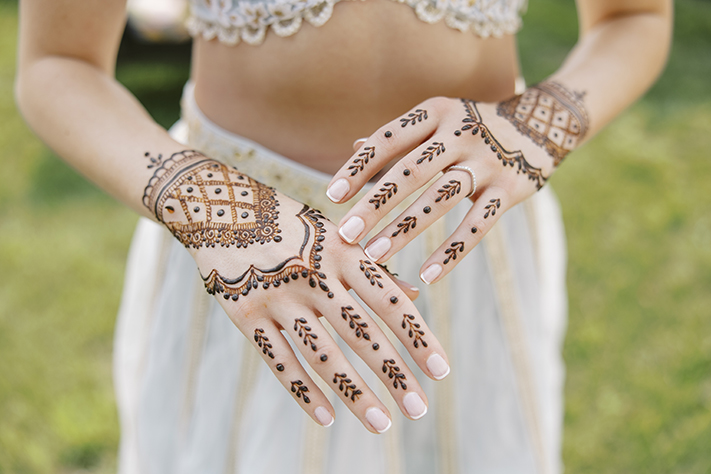 Close up of brides henna designs on her hands