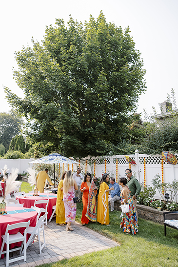 Landscape of the backyard and people enjoying the party